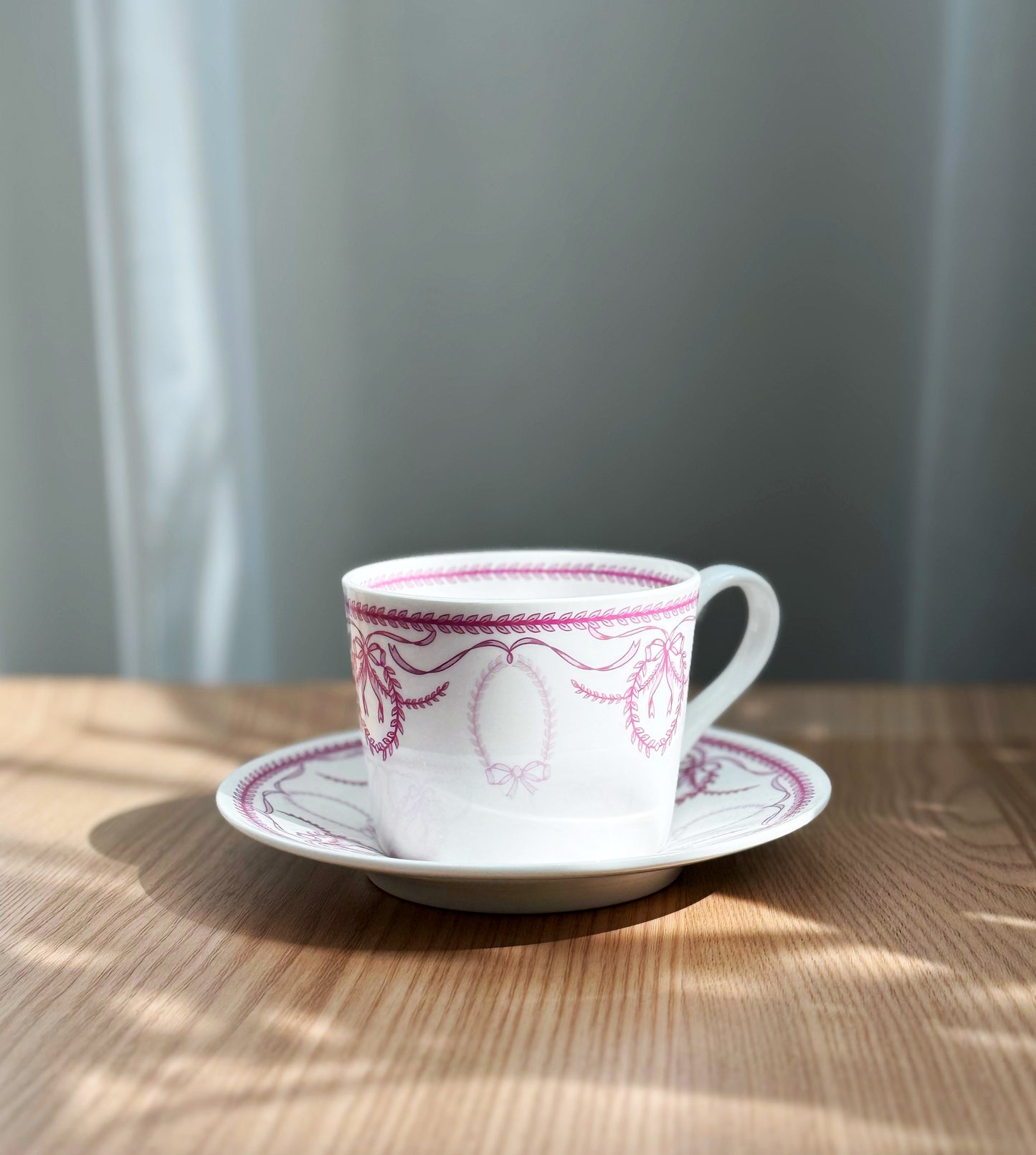 Purple bow frames cup